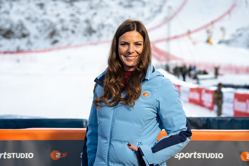Editorial portrait of ZDF sportstudio host Amélie Stiefvatter on location at an alpine winter sports venue, captured by Max Sydow for broadcast coverage