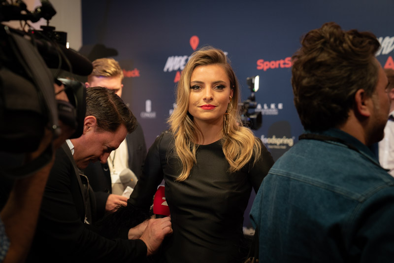 Editorial portrait of actress and presenter Sophia Thomalla on the red carpet at the SportScheck Made for More Awards in Munich, surrounded by reporters and cameras, captured by Max Sydow